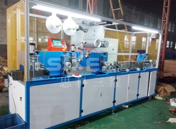 Sticking machine for pressure sensitive adhesive tape